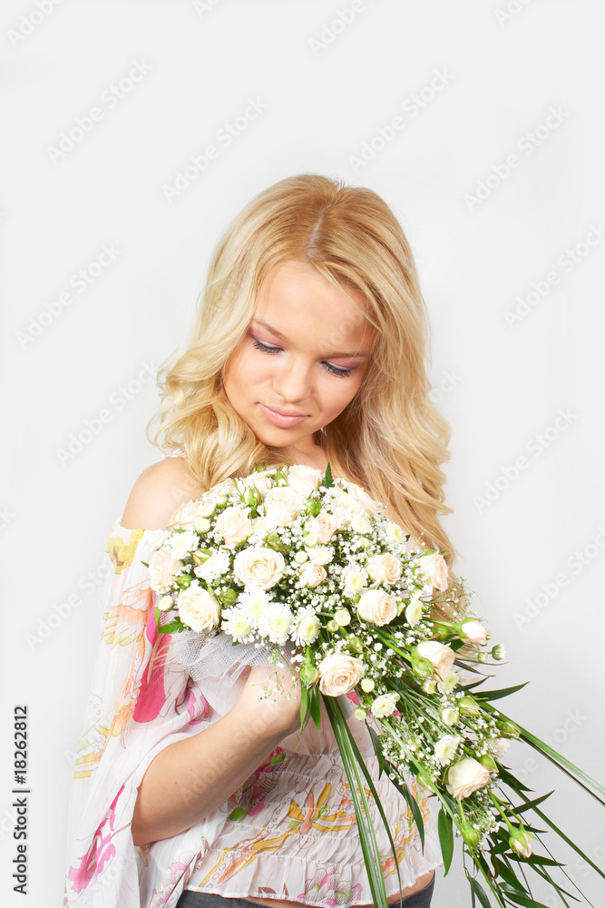 beautiful young blonde girl with a bouquet of flowers beautiful young blonde girl with a bouquet of flowers