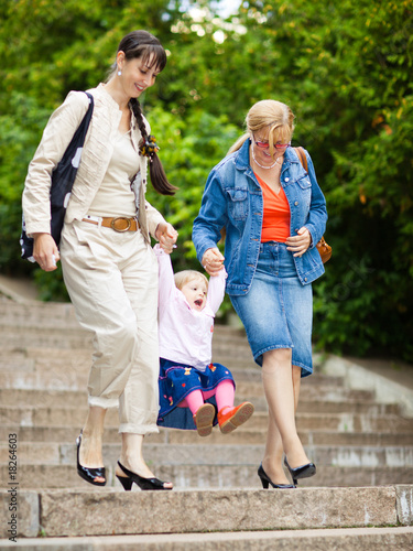 Family on a park staircase © zergkind