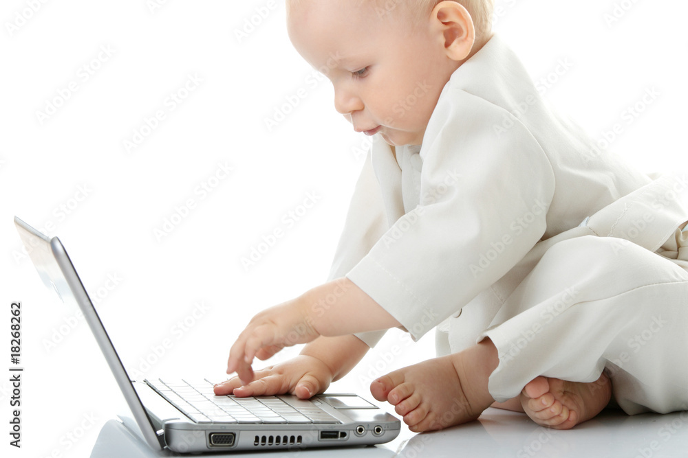 Naklejka premium Baby with laptop
