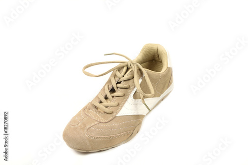 One beige sport shoe - sneaker isolated on white background