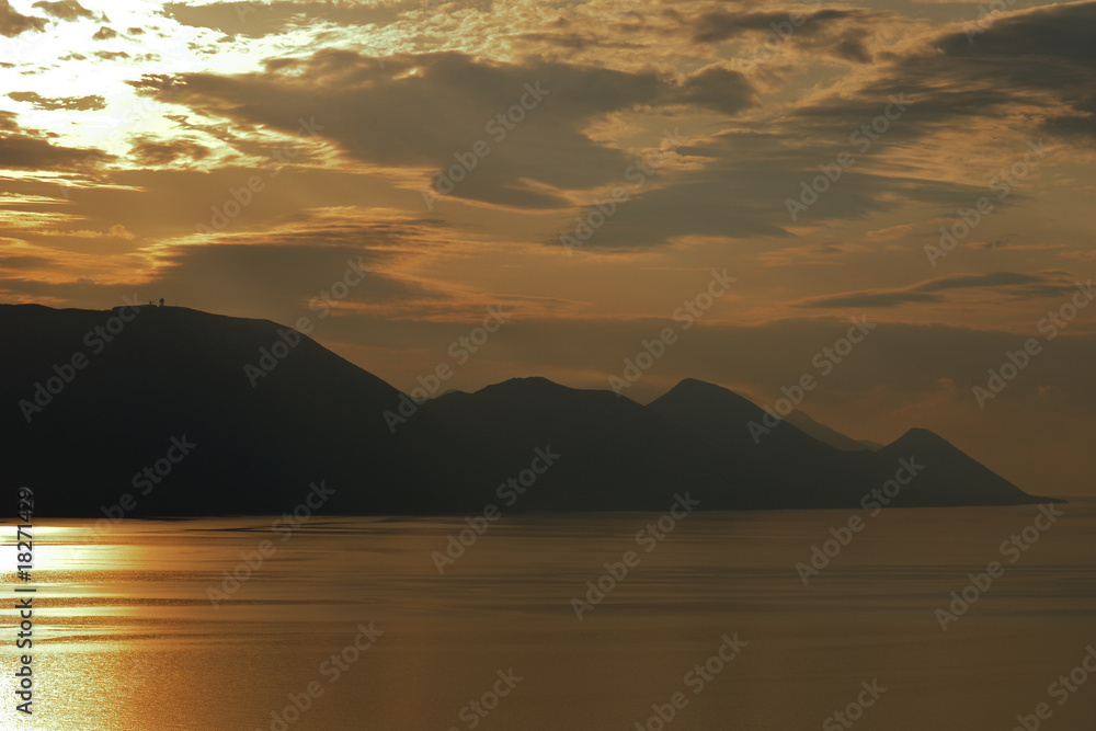 Sunset, sea and mountains