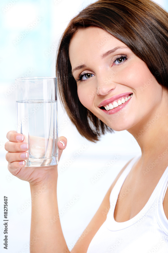 healthy female holds a glass of pure water healthy female holds a glass of pure water