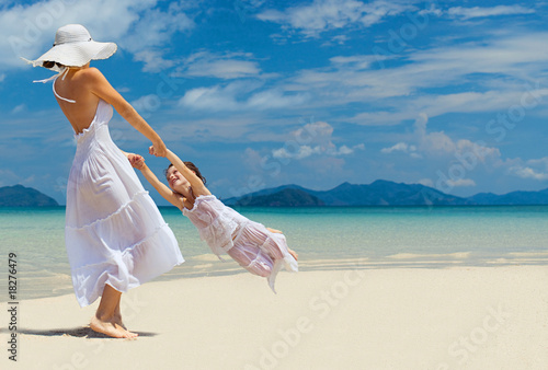 woman and girl on the beach