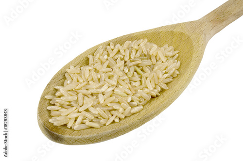 wooden spoon and rice isolated on white background photo