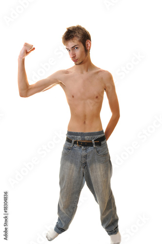 Slender young man flexing with no shirt