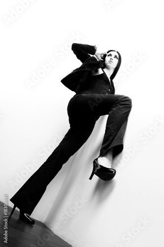 Canvas-taulu young harmonous girl in a suit