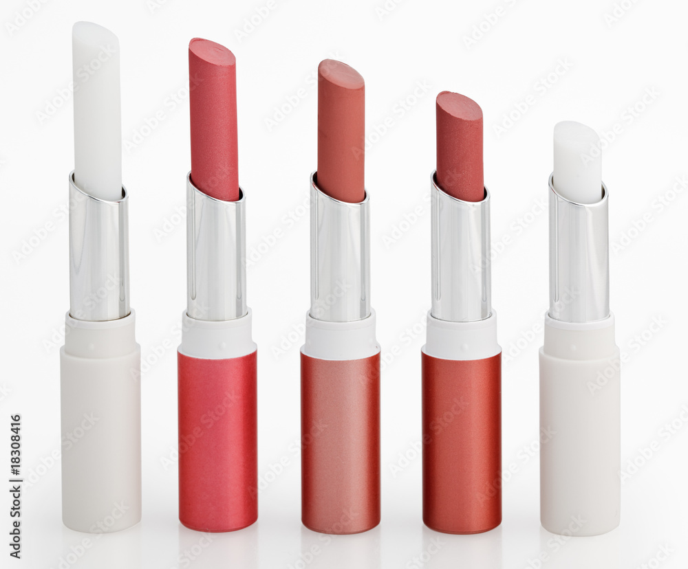 Obraz premium Five Color lipsticks arranged in line isolated on white