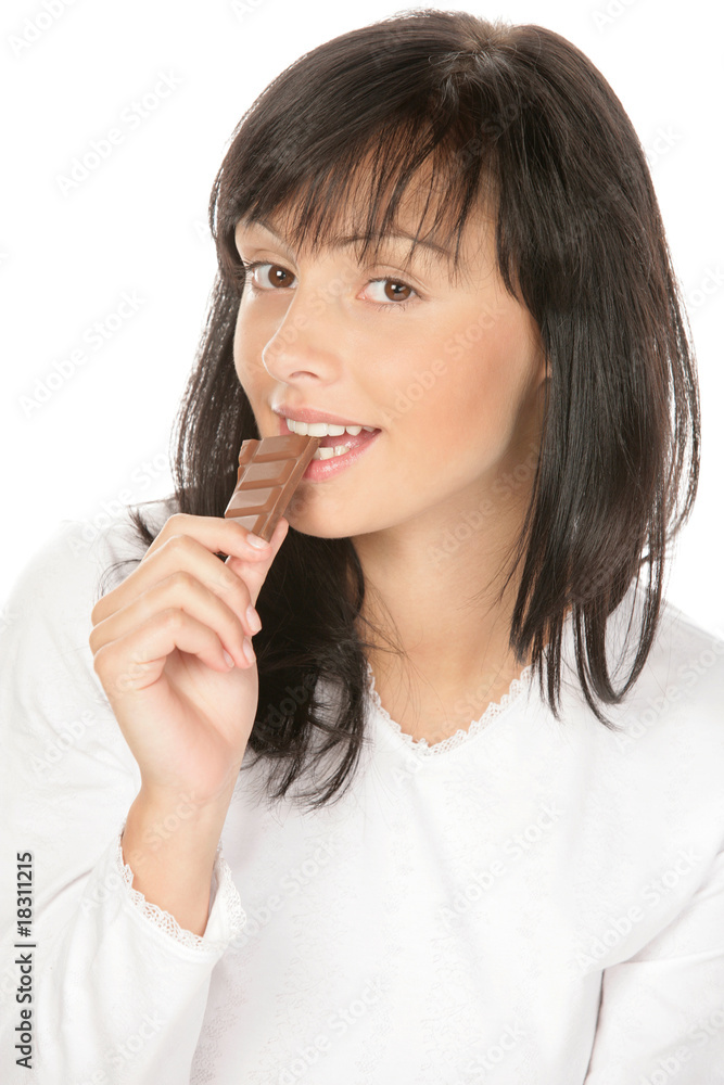 Portrait of young smiling woman eating chocolate Portrait of young smiling woman eating chocolate