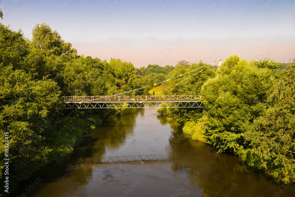 Suspension bridge through the river