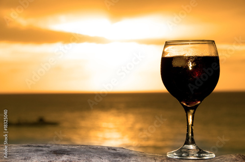 Glass of wine on the beach © VitalyTitov