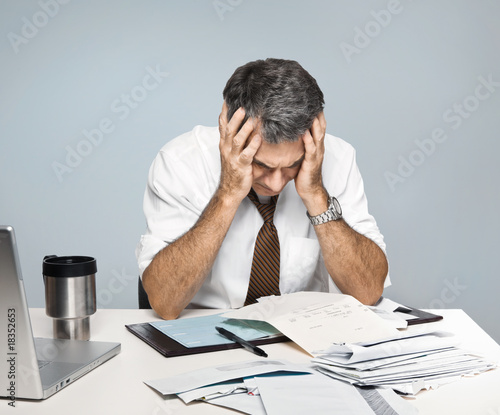 Stressed Man Worries About Economy, Paying Bills, Retirement photo