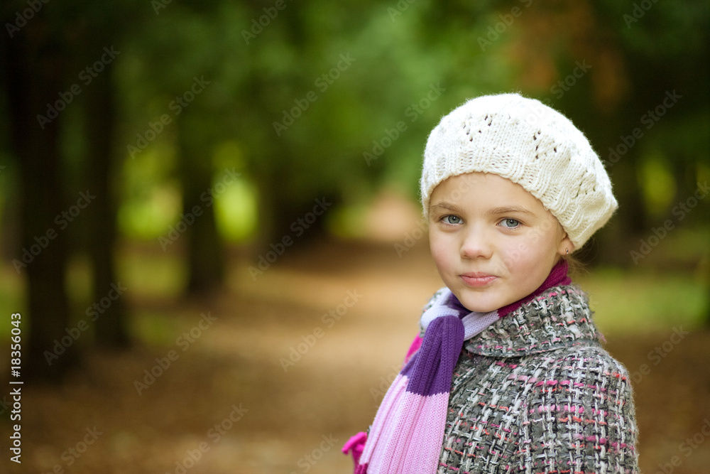 smiling young nice girl in modern coat standing turned smiling young nice girl in modern coat standing turned