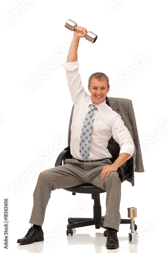 businessman with dumbell on office chair