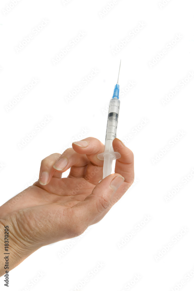 hand with syringe hand with syringe