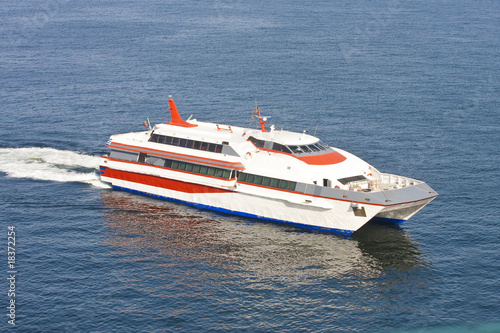 Fotografie Orange and White Ferry on Blue