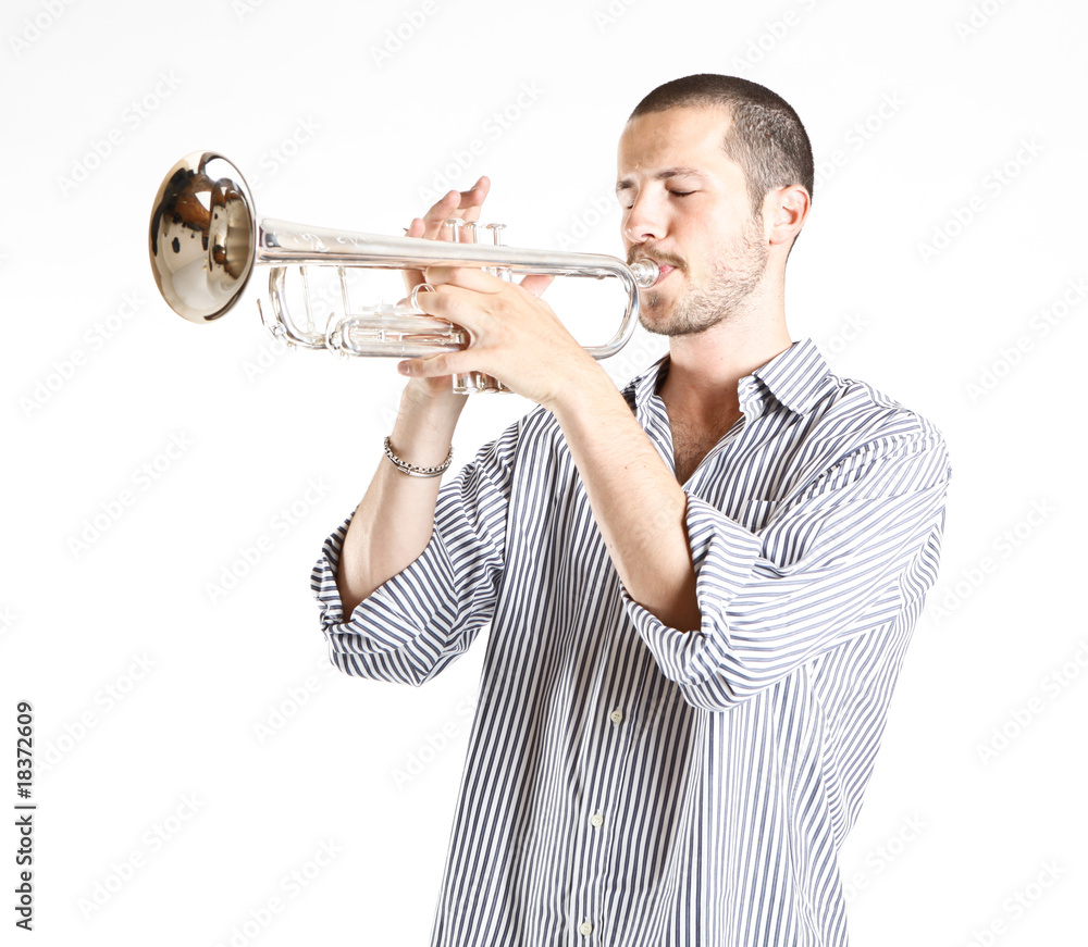 Obraz premium young man playing the trumpet