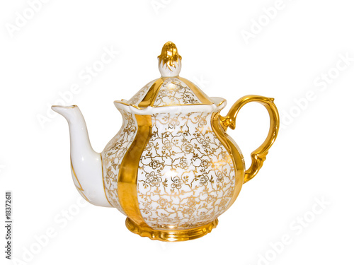 Porcelain teapot from an old antique service on a white