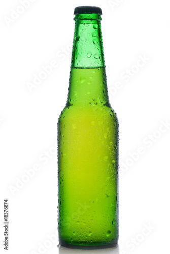 Green beer bottle with water drops isolated on white © artjazz