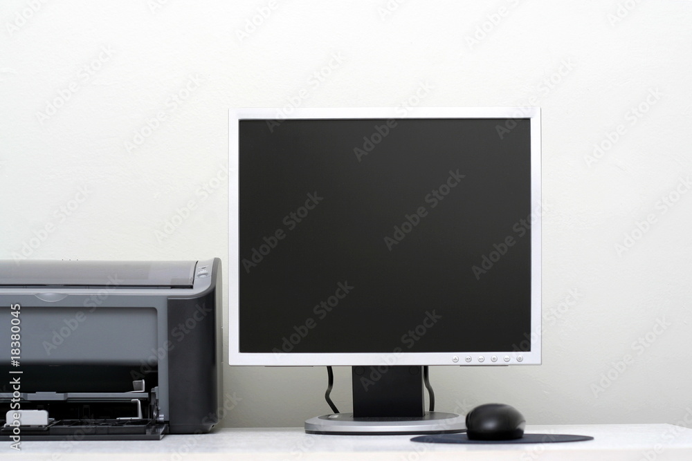 LCD monitor, jet printer and the mouse on a table LCD monitor, jet printer and the mouse on a table
