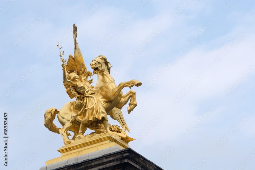 gold statue from alexandre III bridge in paris