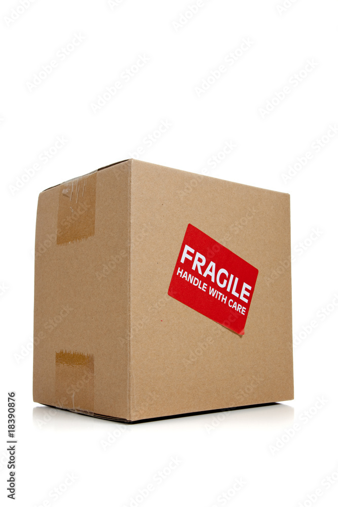 A cardboard moving box with a fragile sticker A cardboard moving box with a fragile sticker