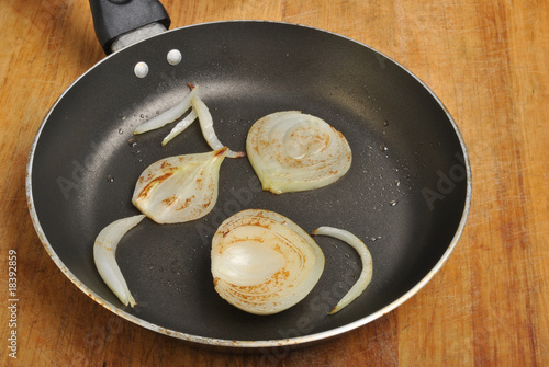 fried organic onion with oil in a pan