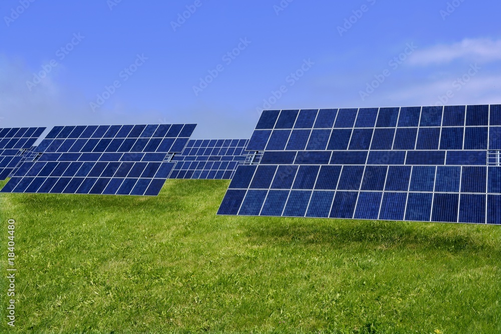 Clean electric energy solar plates in meadow Clean electric energy solar plates in meadow