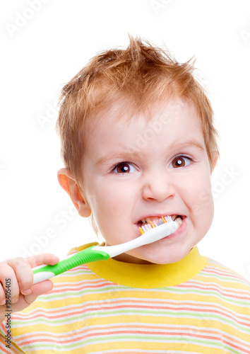Little child with dental toothbrush brushing teeth