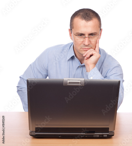 Young businessman working at laptop photo