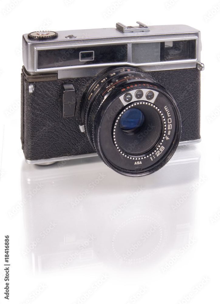 Old film camera isolated on white background