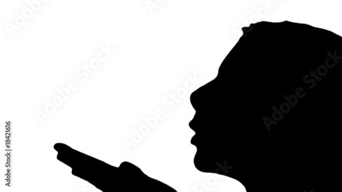 Woman blows kisses in silhouette - HD