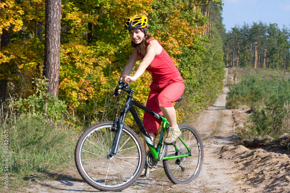Fototapeta premium Girl biking