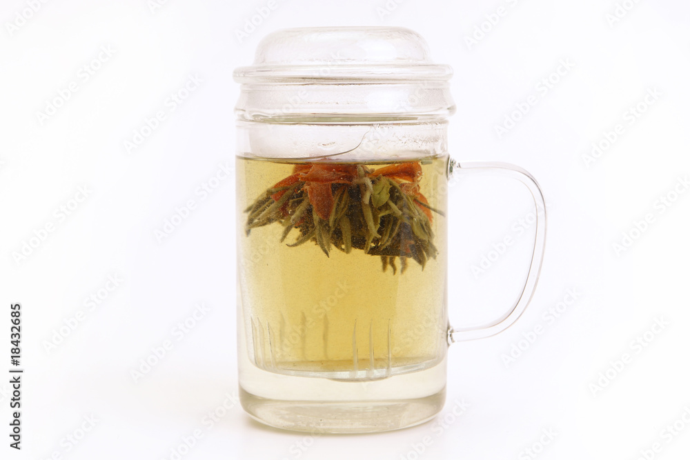 Herbal tea with tea flower in glass cup