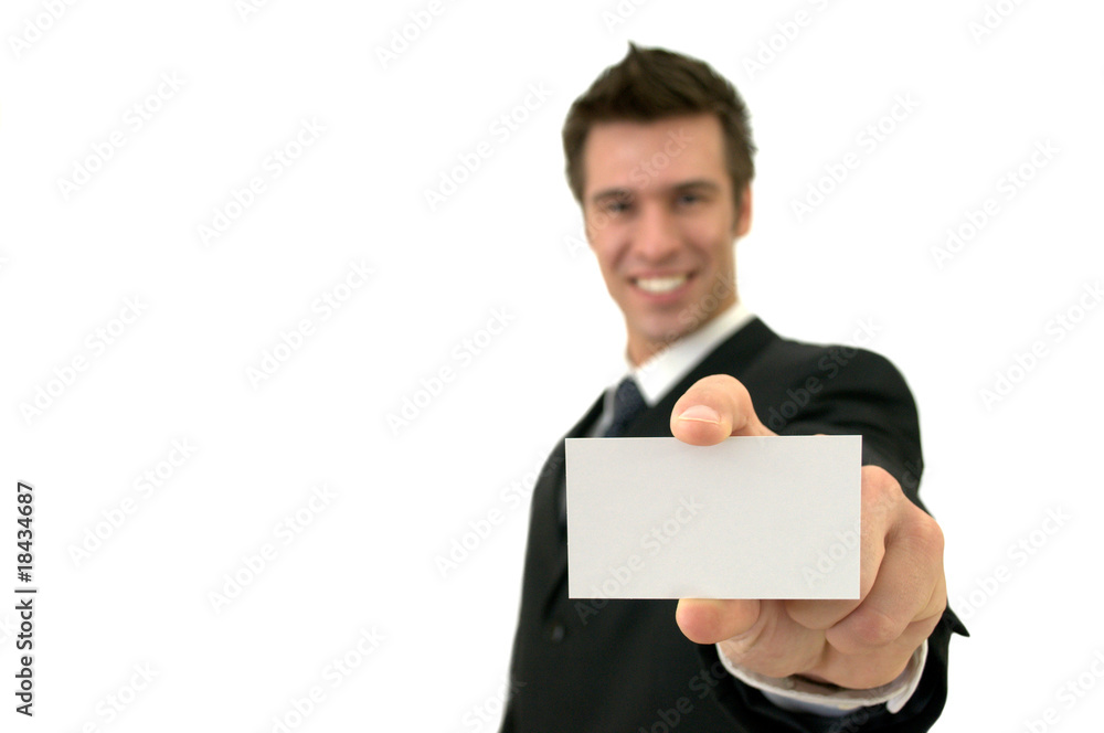 Isolated smiling young man showing a business card Isolated smiling young man showing a business card