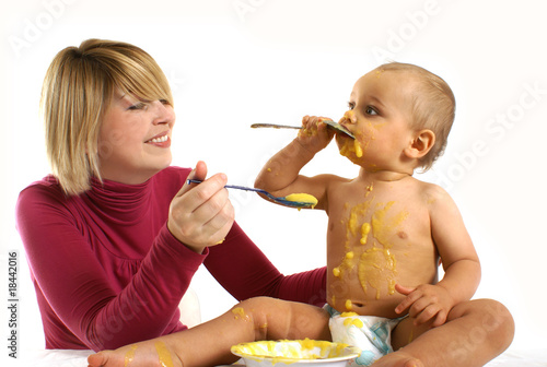 Mother feeding her little baby
