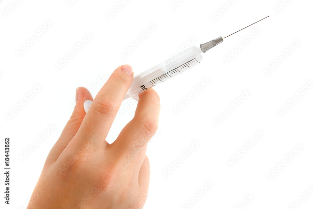 hand holding syringe and ready for injection hand holding syringe and ready for injection