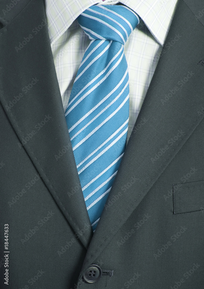 Detail of a Business man Suit with blue tie Detail of a Business man Suit with blue tie