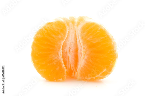 peeled mandarin in half over white background