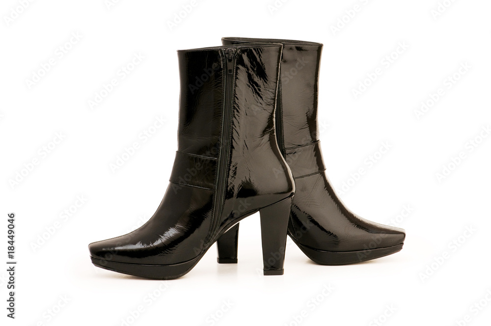Black boots isolated on the white background Black boots isolated on the white background