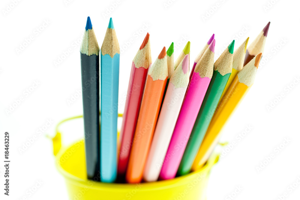 Fototapeta premium crayons in yellow bucket
