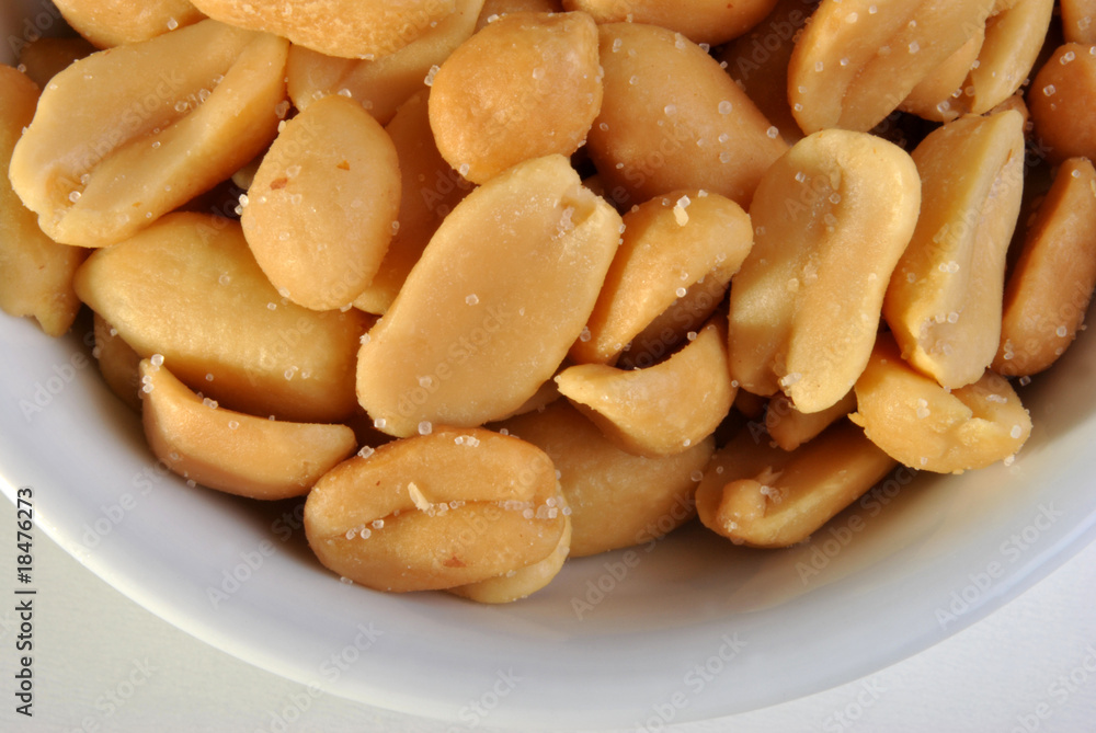 roasted salted peanuts in a white bowl roasted salted peanuts in a white bowl