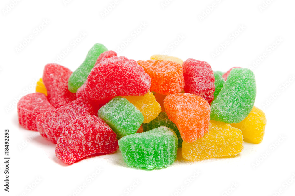 Assorted rainbow chewy candies on white