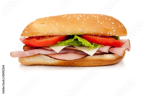 Assorted meat sandwich with fixings on a hoagie