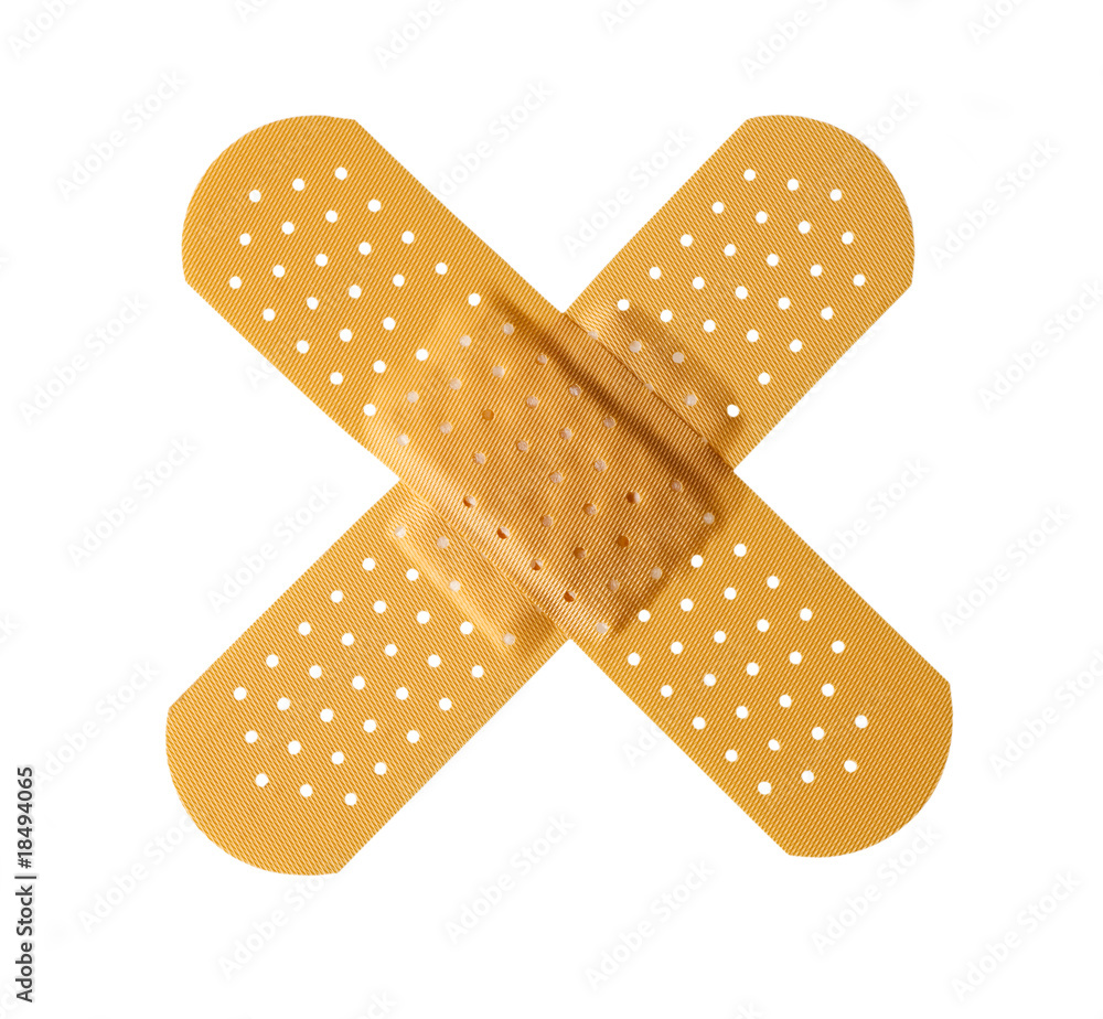 Two bandages forming a cross shape isolated on white Two bandages forming a cross shape isolated on white