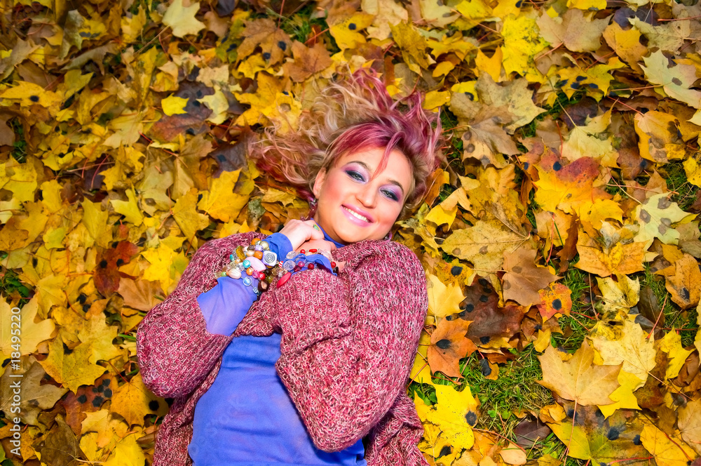 young smiling woman resting on the ground young smiling woman resting on the ground