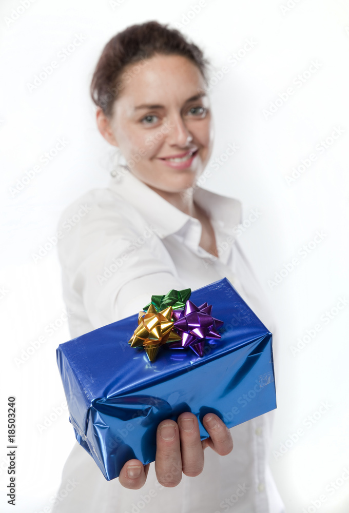 Beautiful Caucasian woman hodling out a present Beautiful Caucasian woman hodling out a present