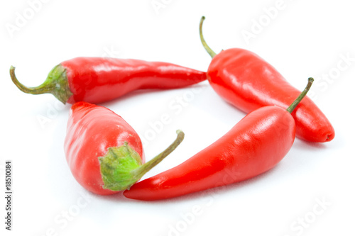 Four red spice pepper isolated