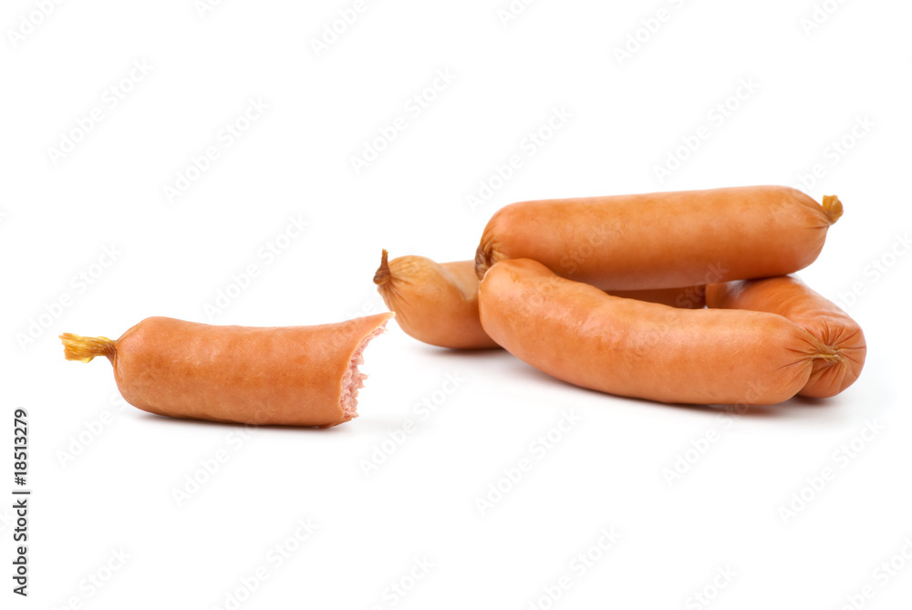 Few whole and one half-eaten sausages Few whole and one half-eaten sausages