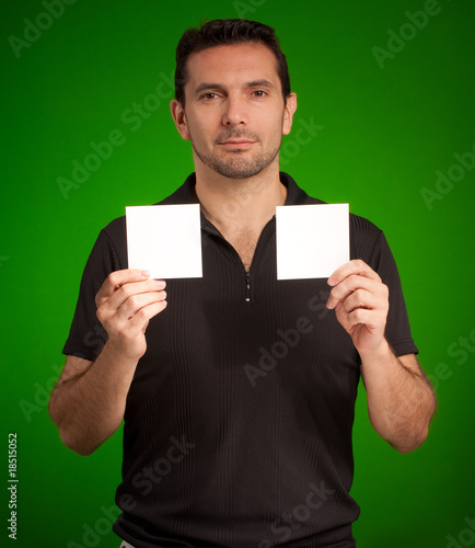 Man holding two blank cards