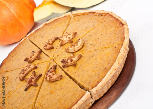 whole Pumpkin pie cut into slices